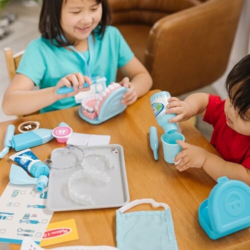 Children playing with a dentist toy set at a table.