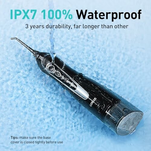 Waterproof oral irrigator with water splash on blue background.